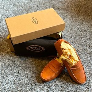 Tod’s orange loafers